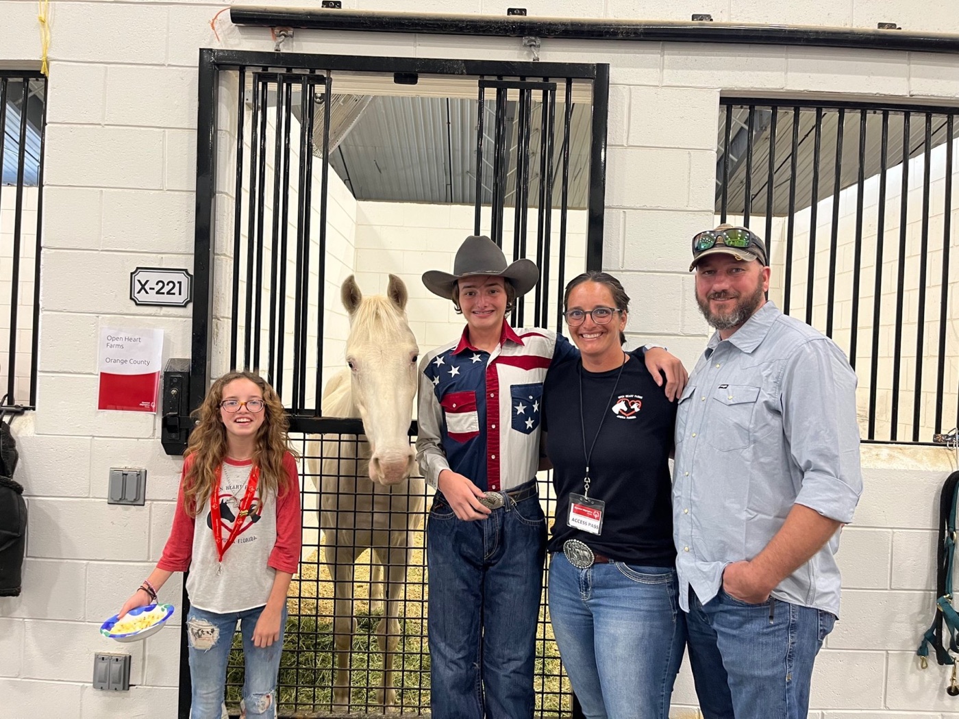 The Beasley family with a horse at the beginning of Open Heart Farms